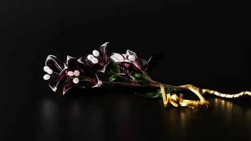 Một cành hoa bằng thủy tinh màu tím trên nền đen